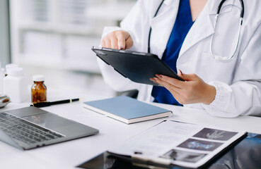 Wall Mural - Medical technology concept. Doctor working with mobile phone and stethoscope in office.