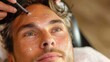 © LifeMedia - In a tranquil spa setting, a close-up of a man's face being treated with specialized skincare products applied by a professional, highlighting the importance of skin care.