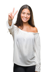 Sticker - Young beautiful arab woman over isolated background smiling with happy face winking at the camera doing victory sign. Number two.