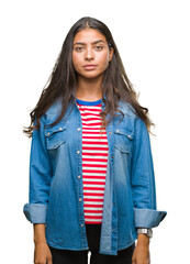 Poster - Young beautiful arab woman over isolated background with serious expression on face. Simple and natural looking at the camera.