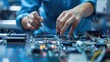 © KKC Studio - Precision Work: Close-Up of Industrial Workers Assembling Electronic Components in Modern Manufacturing Plant