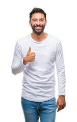 Sticker - Adult hispanic man over isolated background doing happy thumbs up gesture with hand. Approving expression looking at the camera with showing success.