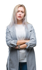 Sticker - Young blonde business woman wearing jacket over isolated background skeptic and nervous, disapproving expression on face with crossed arms. Negative person.