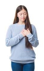 Sticker - Young Chinese woman over isolated background smiling with hands on chest with closed eyes and grateful gesture on face. Health concept.