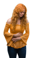 Poster - Young redhead woman with hand on stomach because nausea, painful disease feeling unwell. Ache concept.