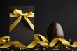 © Jahid CF 5327702 - Easter gift card with chocolate easter egg with golden ribbon Bow isolated