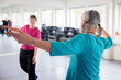 © Johnér - Woman with pigtails exercising in fitness studio