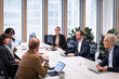 © Johnér - Multiracial business people discussing over conference table in office