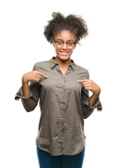 Sticker - Young afro american woman wearing glasses over isolated background looking confident with smile on face, pointing oneself with fingers proud and happy.