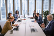 © Johnér - Group of multiracial business people sitting over conference table in office