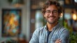 © Elev8to9 - Happy Man with Glasses and Curly Hair Posing