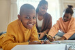 © peopleimages.com - Boy, black child and portrait in living room for homework, learning literature or education. Family, young kids with woman parent on floor for teaching, growth development or bonding together in home