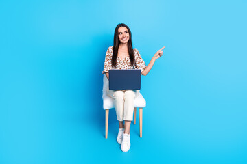 Poster - Full body portrait of nice young lady laptop indicate finger empty space wear top isolated on blue color background