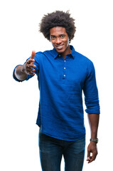 Wall Mural - afro american man over isolated background smiling friendly offering handshake as greeting and welco