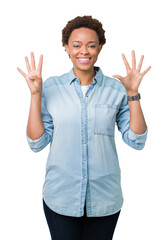 Sticker - Young beautiful african american woman over isolated background showing and pointing up with fingers number nine while smiling confident and happy.