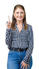 Canvas Print - Middle age mature business woman over isolated background showing and pointing up with finger number one while smiling confident and happy.