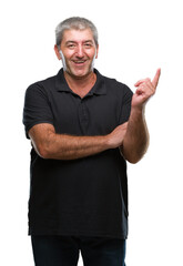 Handsome senior man over isolated background with a big smile on face, pointing with hand and finger to the side looking at the camera.