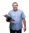 © Krakenimages.com - Handsome senior inspector man holding clipboard over isolated background with a happy face standing and smiling with a confident smile showing teeth