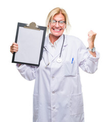 Wall Mural - Middle age blonde doctor woman holding clipboard over isolated background screaming proud and celebrating victory and success very excited, cheering emotion