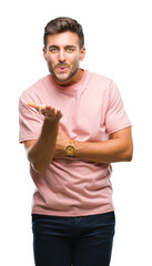 Canvas Print - Young handsome man over isolated background looking at the camera blowing a kiss with hand on air being lovely and sexy. Love expression.