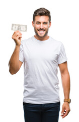 Poster - Young handsome man holding dollars over isolated background with a happy face standing and smiling with a confident smile showing teeth