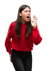 Sticker - Young beautiful hispanic wearing red sweater shouting and screaming loud to side with hand on mouth. Communication concept.