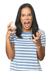 Wall Mural - Young Latina posing in studio screaming with rage.