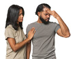 © Asier - Young Latino couple in studio having a head ache, touching front of the face.