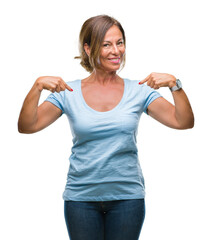 Poster - Middle age senior hispanic woman over isolated background looking confident with smile on face, pointing oneself with fingers proud and happy.