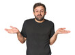 © Asier - Studio portrait of young Hispanic male doubting and shrugging shoulders in questioning gesture.