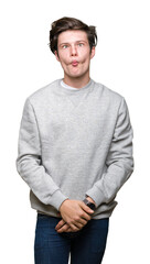 Sticker - Young handsome sporty man wearing sweatshirt over isolated background making fish face with lips, crazy and comical gesture. Funny expression.