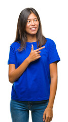 Poster - Young asian woman over isolated background cheerful with a smile of face pointing with hand and finger up to the side with happy and natural expression on face looking at the camera.