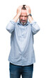 © Krakenimages.com - Middle age hoary senior business man over isolated background suffering from headache desperate and stressed because pain and migraine. Hands on head.