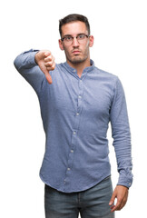 Poster - Handsome young elegant man wearing glasses looking unhappy and angry showing rejection and negative with thumbs down gesture. Bad expression.