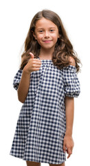 Poster - Brunette hispanic girl wearing black and white dress happy with big smile doing ok sign, thumb up with fingers, excellent sign