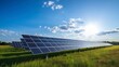 © Voilla - Solar energy panels in a green field with blue sky and sun