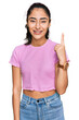 © Krakenimages.com - Hispanic teenager girl with dental braces wearing casual clothes pointing finger up with successful idea. exited and happy. number one.