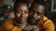 © tiagozr - Close-up of a loving couple in a cozy indoor setting.