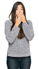 Canvas Print - Young brunette woman wearing casual winter sweater shocked covering mouth with hands for mistake. secret concept.