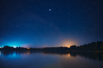 Wall Mural - Night Stars Above Lake. Natural Starry Sky Background Backdrop Landscape