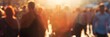 © Aksana - Blurred crowd in warm sunlight glow, people walking, urban life concept