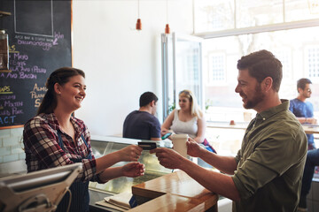 Woman, pay and man in cafe with gift card, service and transaction in coffee shop. Barista, female person and loyalty member with order for support local, cashless banking and finance for sale