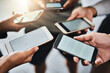 © SunriseDon/peopleimages.com - Cellphone, mockup and hands of people in group for networking on social media, mobile app or internet. Technology, contact and friends in circle with phone for connectivity or notification on screen.