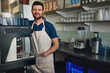 © peopleimages.com - Waiter, man or smile on portrait in restaurant for customer service, hospitality or cafe startup. Small business, barista or happy server at counter with ready to welcome, bistro management or pride