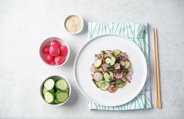 Wall Mural - Seaweed radish cucumber salad in a plate