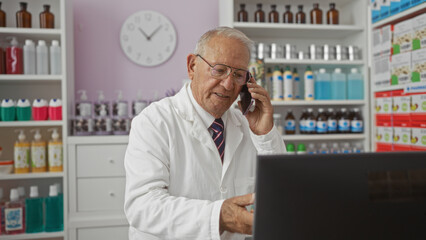 Sticker - Elderly man in a pharmacy talking on the phone while working on a computer, surrounded by shelves of medicines and bottles, conveying a professional and attentive atmosphere.