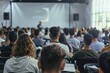 © vefimov - A large group of people are sitting in a classroom, listening to a speaker. The speaker is talking about a topic that is important to the audience. Scene is serious and focused
