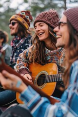 Wall Mural - A group of people are sitting around a guitar, smiling and laughing. One of the women is playing the guitar while the others are watching her. The atmosphere is cheerful and relaxed