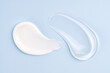 © ADDICTIVE STOCK - Cosmetic smears of cream presented on a blue background