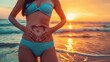 © Lull - Beach body goals. Achieve a toned stomach like this woman on the beach. Discover the best tips and tricks for achieving your fitness goals.